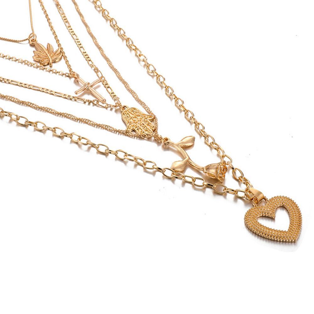 Mehrreihige Goldkette mit symbolischen Anhängern