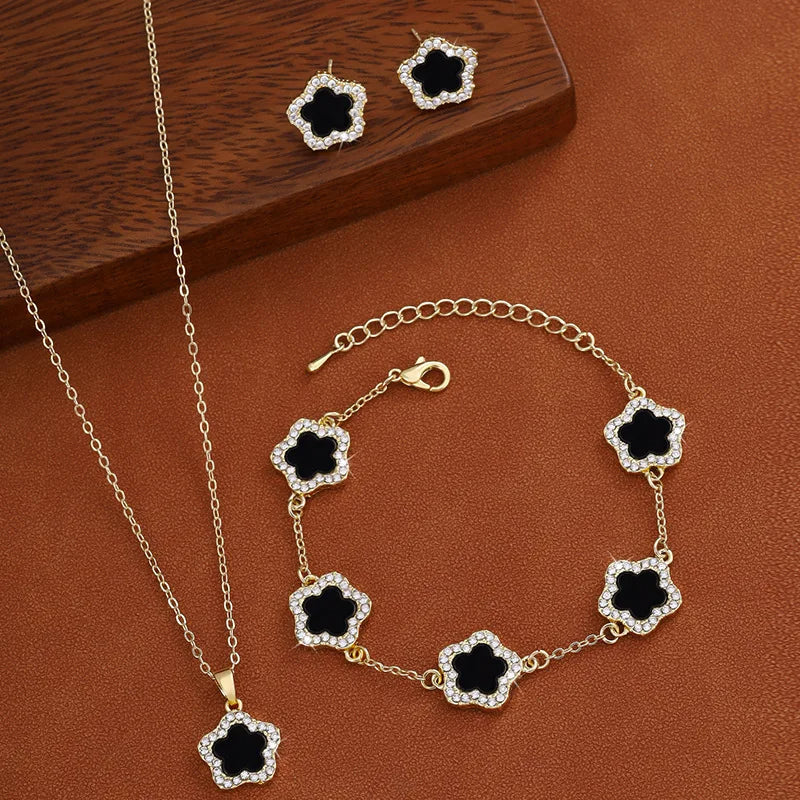 3-teiliges Schmuckset: Halskette, Armband & Ohrringe mit Fünf-Blatt-Blume in Schwarz