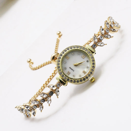 Armbanduhr mit Ausziehverschluss in Gold